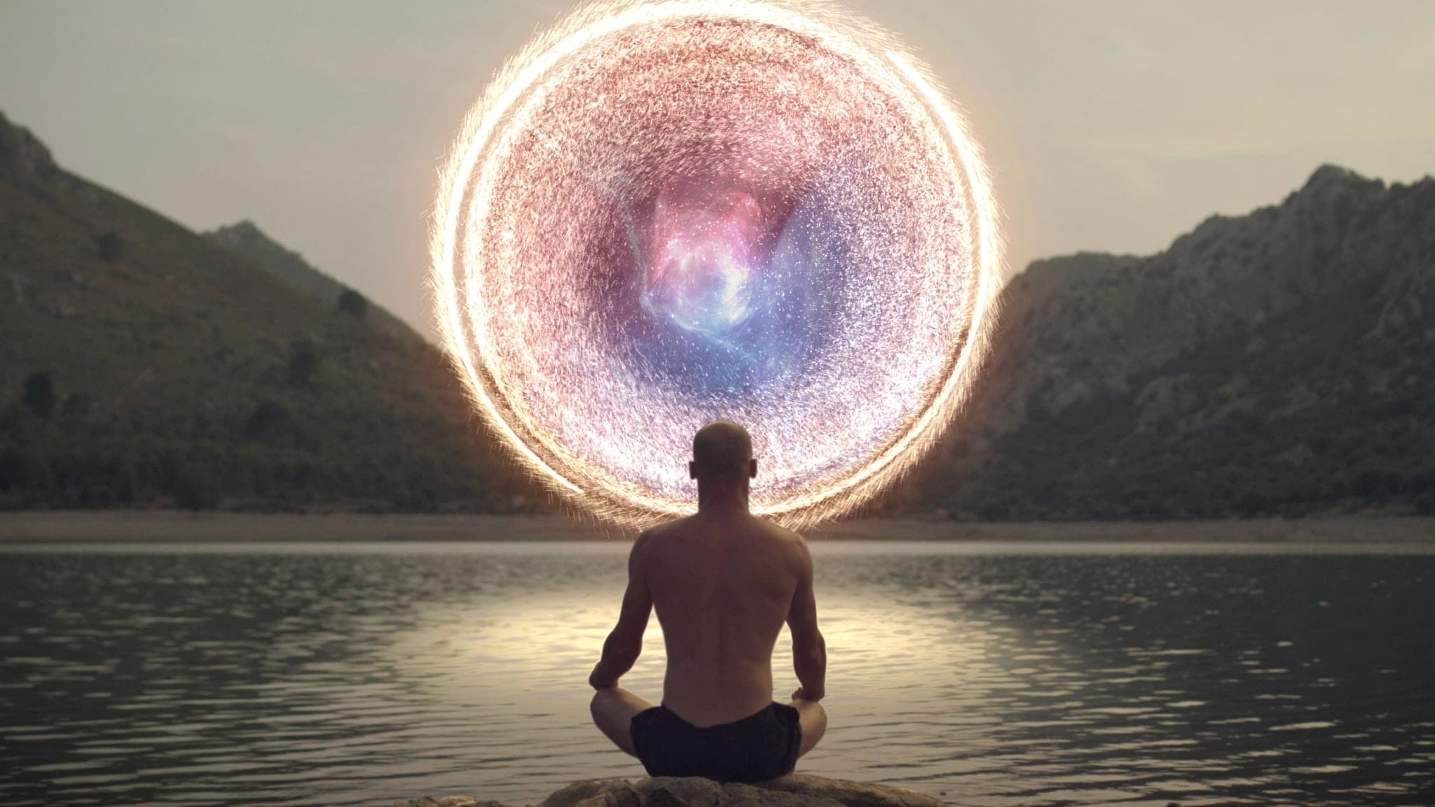 1070156776 Meditating man opening portal to cosmic energy.